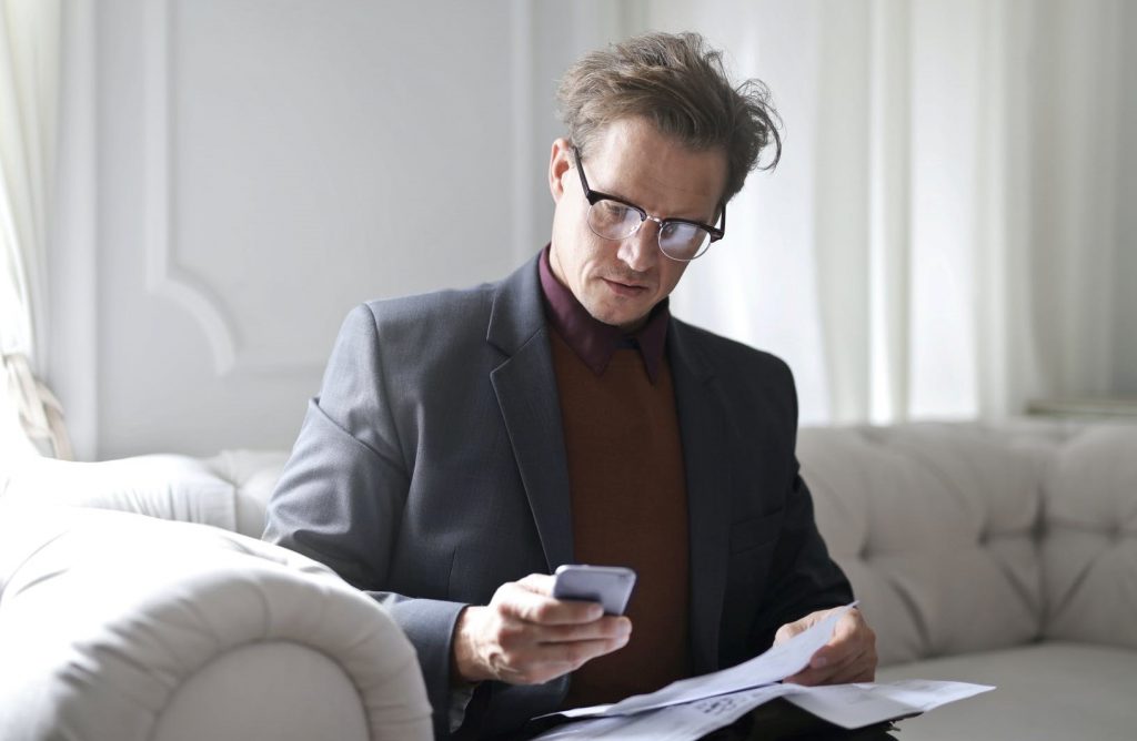 Business man reading about accountability